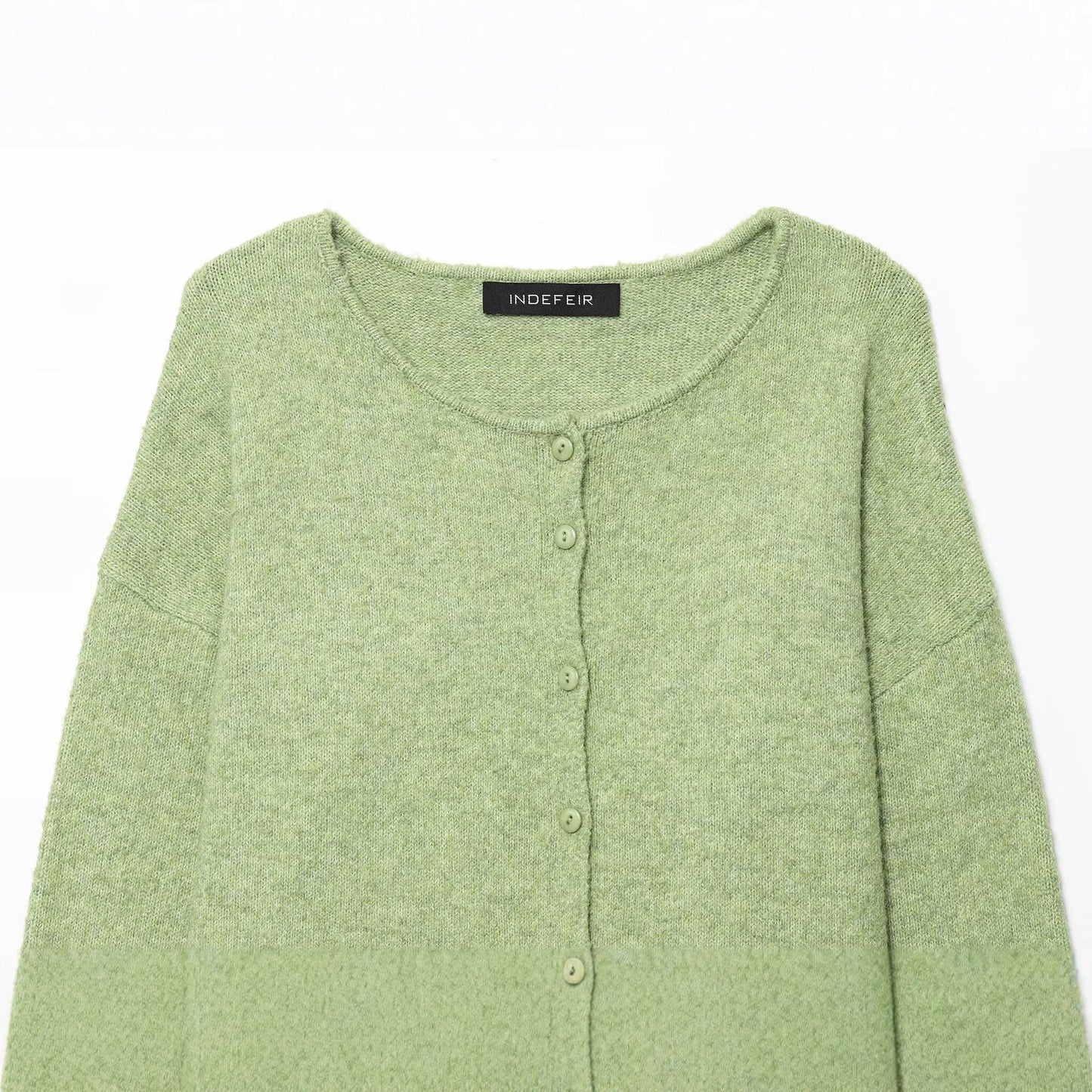 Round neck long sleeved single breasted solid color knitted sweater for women