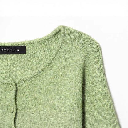 Round neck long sleeved single breasted solid color knitted sweater for women