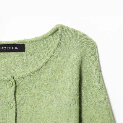 Round neck long sleeved single breasted solid color knitted sweater for women