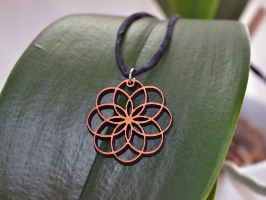 Dahlia Pendant in wood on leather cord